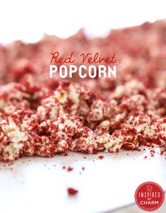 red velvet popcorn on a white platter with the words red velvet popcorn over it