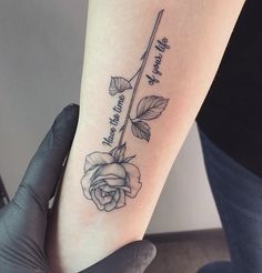 a woman's foot with a rose tattoo on it that reads, i love you to the moon and back