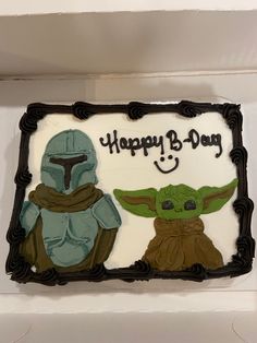 a star wars themed birthday cake with an image of the child and baby yoda