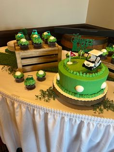 a golf themed birthday cake and cupcakes on a table