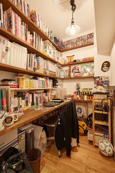 a room filled with lots of books and other items