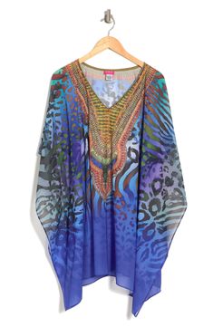 Unleash your free boho spirit in this poncho styled with vivid allover prints. 34'' length (O/S) V-neck Kimono sleeves All-over print Woven 100% polyester Dry clean Imported Model stats: 5'10", 32" bust, 25" waist, 36" hip. Model is wearing size OS. Bohemian Multicolor Print V-neck Kaftan, One Size Bohemian Blue Cover-up, Bohemian Blue One-size Cover-up, Multicolor Long Sleeve Poncho For Beach, Multicolor Long Sleeve Poncho For The Beach, Multicolor One-size Poncho For Vacation, Multicolor One Size Poncho For Vacation, Blue Poncho For Spring Vacation, Multicolor Bohemian Printed Cover-up