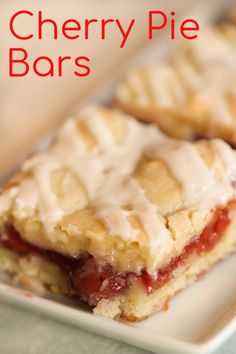 cherry pie bars on a white plate with the words cherry pie bars in red lettering