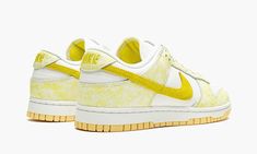 The Women’s Nike Dunk Low “Yellow Strike” is a women’s-only colorway of the retro basketball shoe that was released in August 2021.  Similar to the shoe’s “Purple Pulse” style, the “Yellow Strike” displays white leather on the perforated toe and mid-panel with contrasting blotted patterning on the overlaid panels, in this case, yellow instead of purple.  A yellow suede Swoosh appears on either side and yellow “Nike” branding is stitched onto the back of the shoe.  Moreover, yellow “Nike” with a Nike Dunk Low Yellow, Womens Dunk Low, Retro Basketball Shoes, Yellow Nikes, Nike Brand, Air Jordan 3, Nike Womens, Woven Labels, Jordan 11