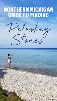 a woman standing on top of a beach next to the ocean with text that reads, northern michigan guide to finding petosky stones