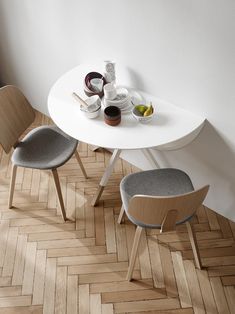 a white table with two chairs next to it