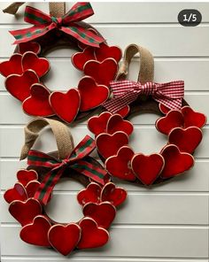 three valentine's day heart wreaths hanging on a wall