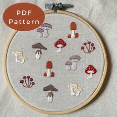 an embroidery pattern with mushrooms on it