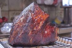 a large piece of meat sitting on top of a rack