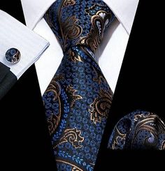 Want to elevate your style with sophistication and flair? Introducing our Men's Blue Gold Floral Silk Necktie Set - a captivating ensemble designed to make heads turn. It includes a luxurious silk necktie, a woven pocket square, and sleek cufflinks, all elegantly packaged to ensure their safety. With its dimensions perfectly tailored for a variety of dress shirts and suit tuxedos, this set exudes refinement. Crafted from high-quality silk using Jacquard woven craft, each piece boasts a high-dens Luxury Blue Ties For Business, Elegant Blue Tie For Business, Elegant Blue Neckwear For Business, Elegant Blue Formal Sets, Blue Elegant Formal Sets, Luxury Blue Suit And Tie Accessories For Semi-formal Occasions, Elegant Blue Ties, Blue Formal Suit And Tie Accessories, Blue Standard Tie For Formal Suit