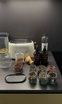 the kitchen counter is covered with spices and condiments for making an appetizer