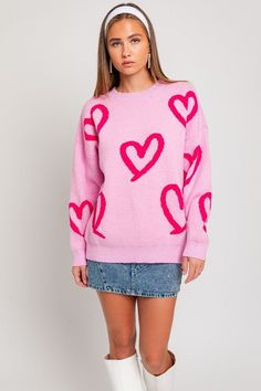 Add a touch of whimsy to your winter wardrobe with our Heart Print Sweater. Featuring an adorable heart pattern and classic silhouette with round neck and long sleeves, this knit offers both comfort and style. Sweater is an oversized, relaxed fit. For a more fitted look, we recommend sizing down. Model is wearing a small. Fabric Contents: 52% Acrylic 28% Nylon 20% Polyester Whimsical Heart, Baggy Sweaters, Pull Rose, Heart Sweater, Sweater Fits, Heart Pattern, Pattern Sweater, Printed Sweater, Pink Fabric