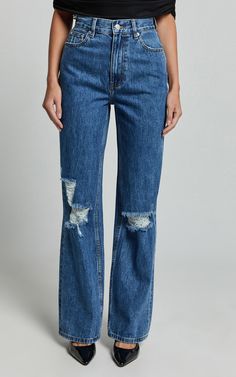 Make a statement in the Miho Jeans - a game-changer in eco-friendly fashion that doesn't sacrifice style for sustainability. These high-waisted, straight-leg denim jeans come in a deep blue wash that screams sophistication with a hint of rebellion, thanks to their strategically placed distressed details. Crafted from recycled cotton, they're as kind to the planet as they are on your curves, blending comfort with the chic street style seamlessly. Product Details: Straight Ripped Jeans Denim Fabri Cheap Dark Wash Pants With Frayed Hem, Affordable Fitted Recycled Denim Jeans, Cheap Relaxed Fit Jeans In Recycled Denim, Affordable Denim Blue Cotton Jeans, Cheap Everyday Jeans In Recycled Denim, Cheap Everyday Recycled Denim Jeans, Cheap Denim Jeans With Contrast Stitching, Straight Ripped Jeans, Eco Friendly Fashion