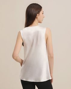 100% Mulberry Silk Breathable & Lightweight Lightweight & Comfortable Silk Sleeveless BlouseStyle: One-piece Silk TopSleeve Type: SleevelessMaterial: 100% 19 Momme Charmeuse Silk. Romantic and alluring, mulberry silk likes a second skin, the smooth, silk fabric will effortlessly caress your body for the ultimate comfort whatever the occasion. This silk blouse is a perfect design for summer. The Swing collar design gives it a trendy and fashionable look, while the sleeveless design keeps you cool Elegant V-neck Evening Vest, Feminine Silk Sleeveless Tank Top, Elegant V-neck Solid Color Vest, Elegant Cami Vest Top, Chic Silk Sleeveless Camisole, Elegant Tank Camisole For Daywear, Chic Sleeveless Silk Camisole, Elegant Camisole For Daywear, Spring Silk Sleeveless Tank Top