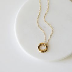 "Beautiful and lovely gold pendant necklace. Made of small gold circle pendant with skinny gold plated brass chain. Soft and warm. Great for gift, everyday or special occasion. Your item will ship in a gift box. Please feel free to contact me if you have any question. ♥ Length 15\" - 20\" ♥ Pendant 5/8\" ♥ Gold plated over brass ♥ See more Rudiana Accessories Rudiana.etsy.com" Dainty Necklace Gold, Gold Circle Necklace, Gold Circle, Ring Pendant, Ring Pendant Necklace, Circle Necklace, Necklace Dainty, Minimalist Necklace, Circle Pendant