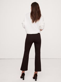 Chic Flared Hem Flares For Work, Chic Flares With Flared Hem For Work, Chic Wide Leg Pants With Flared Hem For Fall, Chic Wide Leg Flared Pants For Fall, Stretch Wide Leg Pants With Flared Hem, Stretch Wide Leg Pants With Flared Hem For Fall, Fall Wide Leg Stretch Pants With Flared Hem, Stretch Elastane Pants With Flared Hem, Fitted Flares With Flared Hem For Workwear