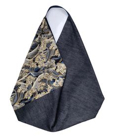 a necktie with a blue and gold design in the middle, on a white background