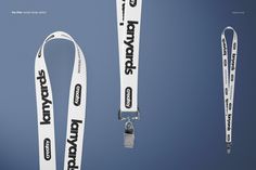 two white lanyards with black words on them