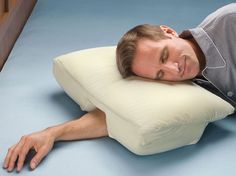 a man laying down with his head on the pillow