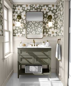 a bathroom with floral wallpaper and two sinks