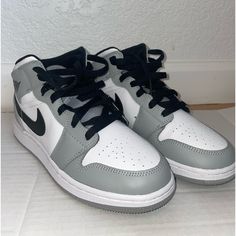 Jordan 1 Mid Sneakers Light Grey. Exact Same Model As In Screenshot. Completely New Only Worn Once. Youth Size 4y. Which Fits A Size 5 Women. Shoes Jordan 1, Mid Sneakers, Jordan Grey, Shoes Jordan, Womens Jordans, Jordan 1 Mid, Jordan Shoes, Jordan 1, Womens Shoes Sneakers