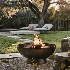 a fire pit sitting in the middle of a yard