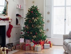 a living room decorated for christmas with presents