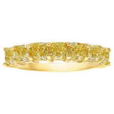 Signature half eternity band style, giving you the look of a full eternity band while using half the amount of diamonds. 3.45 Carat Total Weight 5 Radiant cut diamonds Fancy Yellow Color VS-VVS Clarity Diamond Set in 18k Yellow Gold Handmade in NYC This piece can be viewed before purchase in our showroom in NYC, or at one of our retail partners throughout the country, please inquire for more info. Appraisals can be done on all purchases. We use the best jewelers in New York and can redesign any piece to your liking, using our incredible Fancy Colored Diamonds. Rare Colors was founded after decades of experience in fancy colored diamond trading. It publicly opened the direct door of colored diamonds to jewelry lovers and collectors such as yourself, at best market values. We are one of the Elongated Radiant Cut, Memory Ring, Eternity Diamond Band, Rare Colors, Diamond Half Eternity Band, Fancy Yellow Diamond, Diamond Eternity Band, Bracelet Love, Half And Half