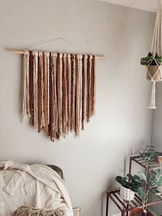 a bedroom with a bed and hanging plants