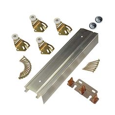 an assortment of metal parts and hardware on a white background