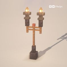 a pair of lights that are on top of a block in the shape of a cross