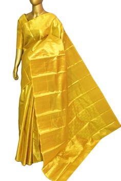 A rich collection in the tissue kanjeevaram silk saree range is here in our inventory. Buy this amazing collection with an elegant and maximized broad pallu and all-over zari work on the whole saree as well to make it look more relevant for any evening party. Color: A shade of golden yellow dual-toned color Technique: Amazing work of golden zari traditional weaving on the whole saree Fabric: Tissue Kanjeevaram Quality: Indyvogue's Assurance of Pure Silk Mark Certified Saree NOTE: Comes with matc Gold Silk Saree With Silk Mark Certification, Elegant Gold Paithani Silk Blouse Piece, Elegant Gold Paithani Silk Pre-draped Saree, Gold Silk Mark Certified Saree For Wedding, Gold Traditional Wear Silk Mark Certified For Festivals, Gold Traditional Wear For Festive Season, Silk Mark Certified, Gold Traditional Wear With Silk Mark For Festivities, Gold Traditional Wear For Festivals With Silk Mark, Gold Wedding Saree Silk Mark Certified