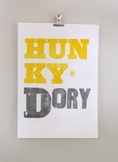 a yellow and black print with the words hun kyy dory on it