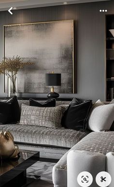 a living room filled with furniture and a large painting on the wall above it's headboard