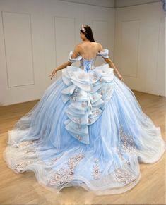 Turn your quinceanera into a magical celebration with this stunning Sky Blue Off-the-Shoulder Quinceañera Dress. This dress features a regal ball gown silhouette and flows gracefully into a dramatic chapel train, making every step feel like a fairy tale moment. The delicate off-the-shoulder neckline highlights your shoulders with elegance, while the sleeveless design ensures comfort throughout your special day. It is made from soft tulle fabric and is adorned with intricate appliques and shimmer Baby Blue Quince Dresses Silver, Blue Quince Dress Long Sleeve, Quinceanera Dresses Blue Quincedresses.com, Baby Blue Quinceanera Dresses Quincedresses.com, Quinceanera Dresses Baby Blue Quincedresses.com, Orange Quinceanera Dresses Elsa Themed, Princess Quinceanera Dresses Couture Candy, Queincearra Dresses Blue, Quinceanera Dress With Lights