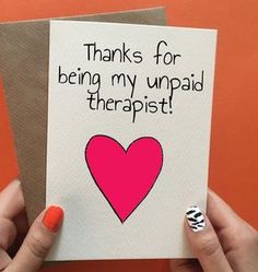 a woman holding up a card that says thanks for being my unpaid therapist