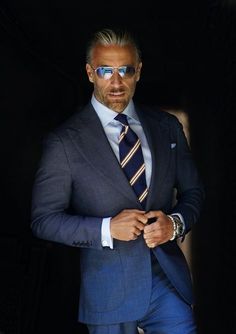 Made from a rare year-round tick-weave wool, this Milano cut three-piece suit features a double-breasted waistcoat, along with our signature one-button placement, double vents, patch pockets, natural shoulder, and wide peak lapels. The accompanying slim trousers are flat front with a wide waistband and feature our vers Christopher Korey, Blue Tick, Older Mens Fashion, Evening Suit, Vest And Pants, Double Breasted Waistcoat, Blue Suit Men, Suit For Men, Jacket Shirt