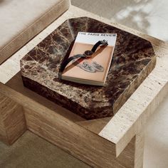 a marble table with a book on it