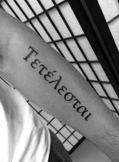 a man with a tattoo on his arm that reads, teteveevau