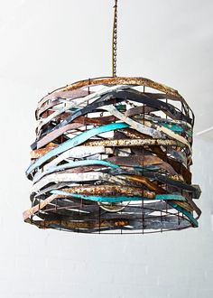 a chandelier made out of old metal strips