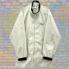 Label size: Large Recommended size: Double Extra Large How it fits: Oversized Pit to pit: 27" Shoulder to bottom: 35" Flaws: Photos show marks if any Material: 100% Polyester Era: 90s Colour: Grey Retro Nike, Sport Nike, 90s Colors, 90s Nike, Rain Coat, Nike White, Lightweight Jacket, White Nikes, Nike Sportswear