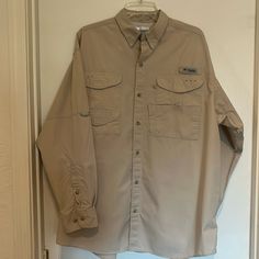 Nwot Columbia Pfg Vented Camping Shirt. Long Sleeve. Khaki. Sz. Lrg. Four Front Pockets With Velcro Hook N Loop Closure. All Pockets Have Weep Holes. Long Sleeves Roll Up And Stay Up With In Built-In Sleeve Loop. This Shirt Is Made For The Outdoors. Camping, Hiking, Hunting, Shopping You’re Ready. It’s A Columbia If You Know, You Know. But If You Don’t Know Make An Offer. Stored In A Smoke Free Facility. Thanks For Looking. Ready To Ship. Khaki Button-up Top For Outdoor, Khaki Long Sleeve Shirt For Outdoor, Spring Khaki Outdoor Shirt, Spring Outdoor Khaki Shirt, Khaki Long Sleeve Tops With Pockets, Outdoor Long Sleeve Shirt With Button Closure, Long Sleeve Shirt With Button Closure For Outdoor, Spring Outdoor Button-up Tops, Spring Button-up Tops For Outdoor