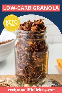 a jar filled with granola sitting on top of a wooden cutting board