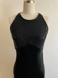 "Sequin style bodice with criss cross back straps zips up in the back. Satin skirt is cut on the bias, so there is some give in the fabric. Made by Be Smart Sequins 100% polyester Dress 51% rayon 49% acetate Labeled size 5/6 Chest 36\" Waist 30-32\" Hips 40-44\" Length from top of shoulder to hem 46\"" Sleeveless Halter Dress With Fitted Bodice For Party, Fitted Sleeveless Halter Dress With Crisscross Straps, Fitted Evening Dress With Cross Back, Party Halter Dress With Back Opening And Fitted Bodice, Fitted Evening Dress With Strappy Back Opening, Fitted Dress With Strappy Back For Party, Fitted Backless Halter Evening Dress, Glamorous Sleeveless Dress With Crisscross Straps, Sleeveless Halter Dress With Crisscross Straps For Evening