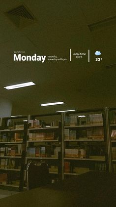 there is a sign that says monday in front of a library full of bookshelves