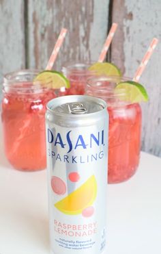 two cans of raspberry lemonade soda next to each other on a table