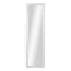 a white mirror sitting on top of a wall