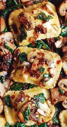 the dish is prepared and ready to be eaten with meat, mushrooms, and spinach