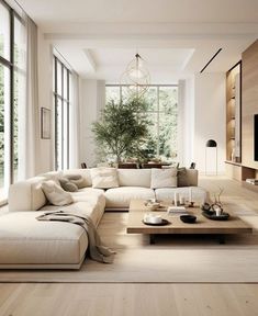 a living room filled with lots of white furniture