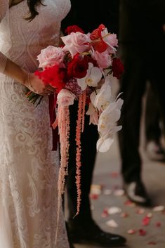 a bride and groom standing next to each other